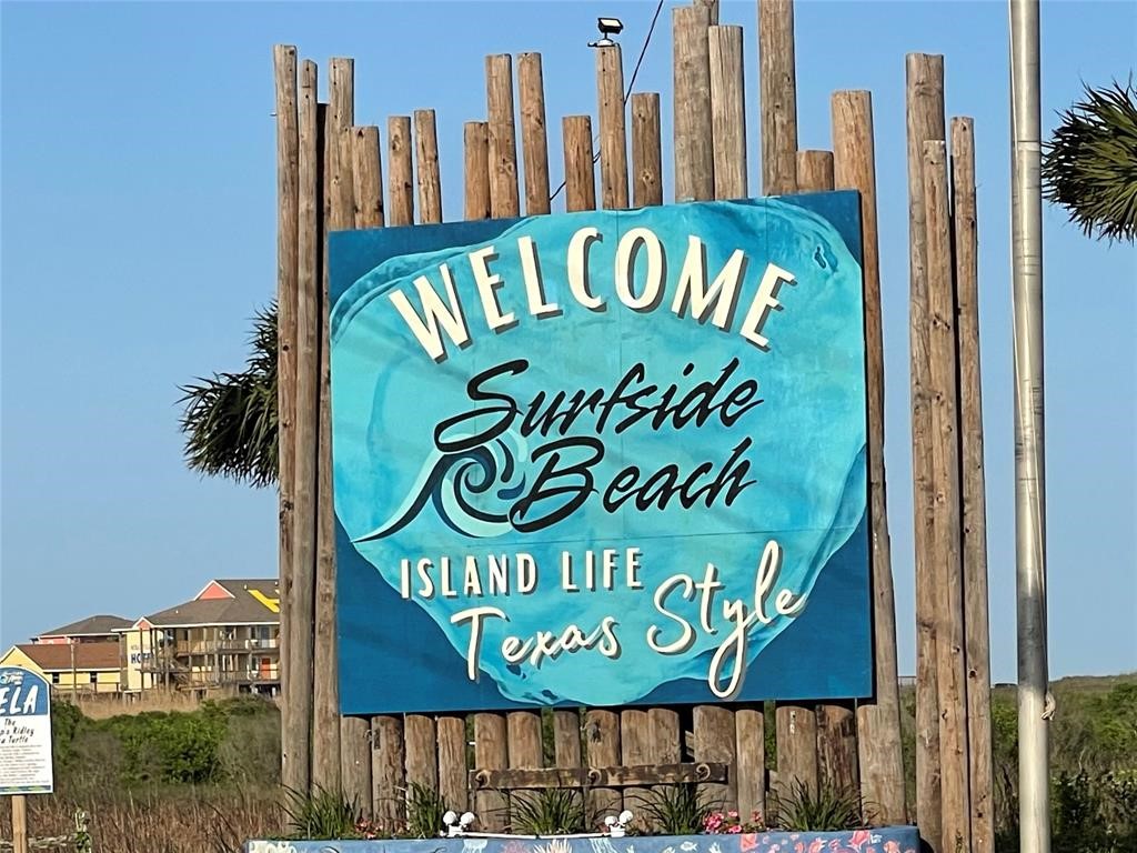 517 Olive Street Surfside Beach, TX 77541 - Photo 4 of 6 a sign board with a book shop