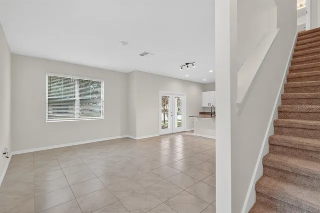 a view of livingroom with furniture and staircase