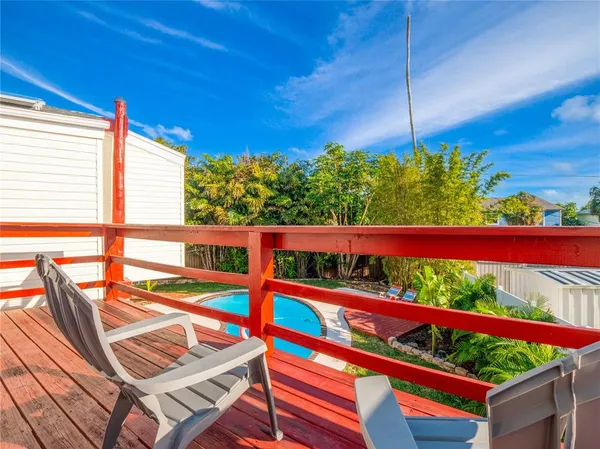 a outdoor living space with furniture and a wooden floor