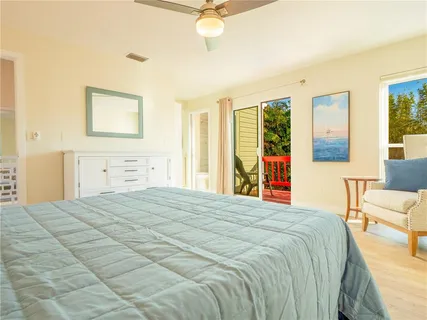a bathroom with a toilet and shower curtain