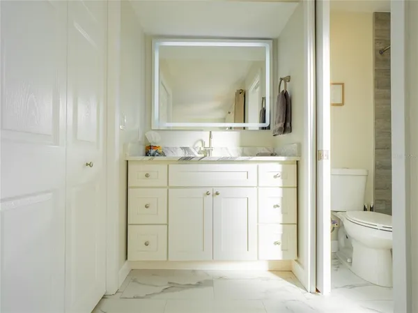 a view of entryway with wooden floor and door