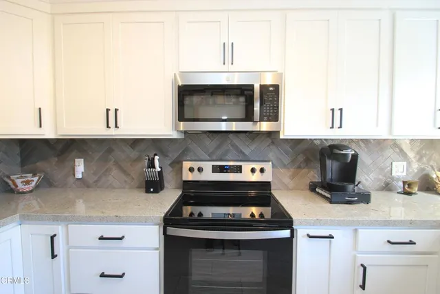 a kitchen with a stove and a microwave