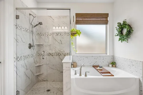 a bathroom with a shower and a sink