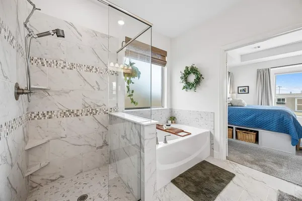 a bath room with a bath tub and a shower