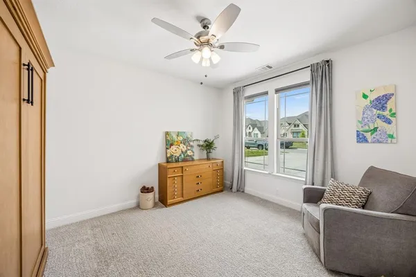 a living room with furniture and window