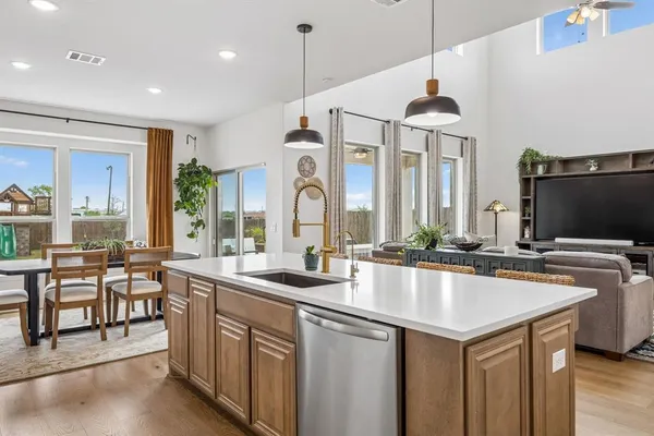 a kitchen with counter top space appliances and a center island
