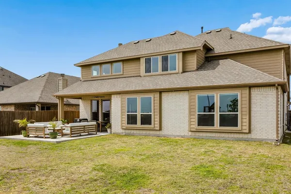 a front view of a house with swimming pool