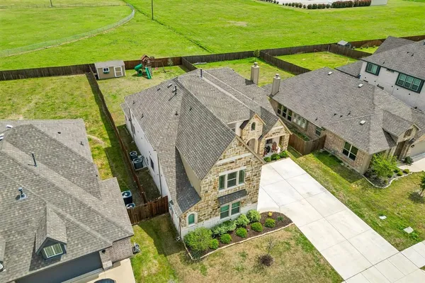 an aerial view of a house with a garden
