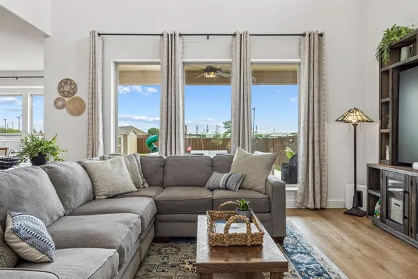 a living room with furniture and a window
