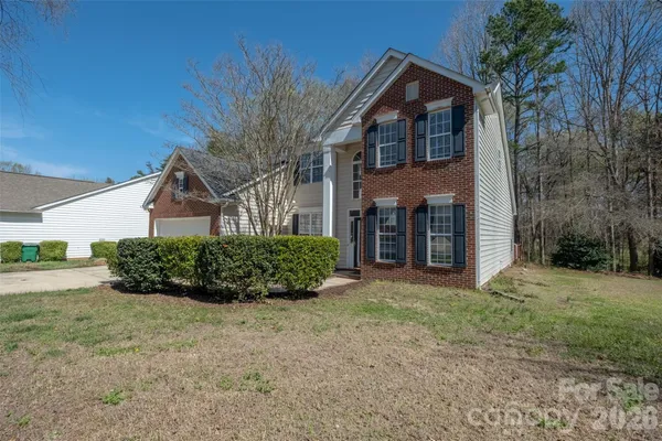 front view of a house with a yard