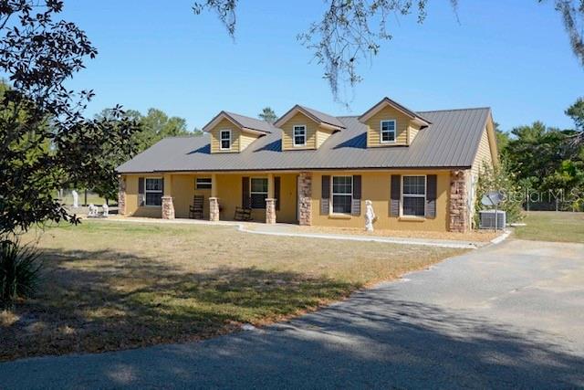 a front view of a house with a garden and yard