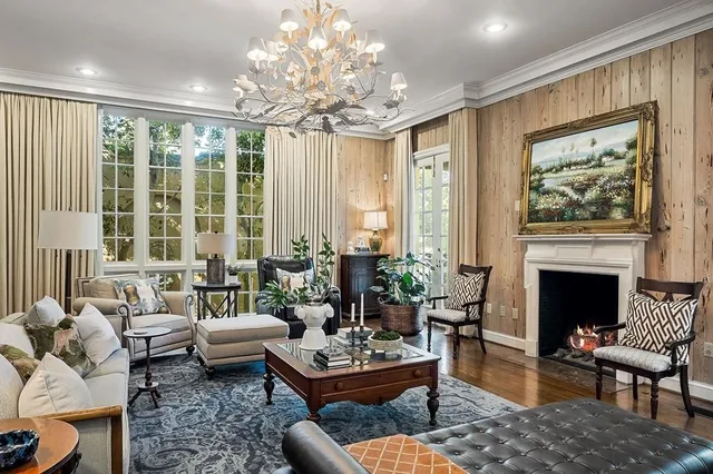 a spacious bathroom with a granite countertop sink and a mirror