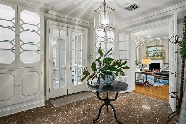 a spacious bathroom with a sinks a vanity and a large mirror