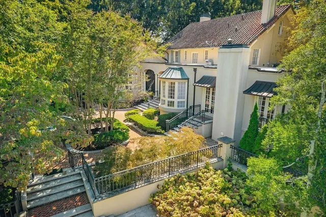 a front view of a house with garden