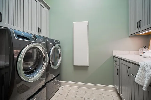 a backyard of a house with lots of green space and fountain