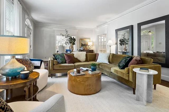 a view of a dining room with furniture and chandelier