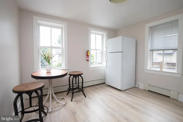 a view of a dining room with furniture and window