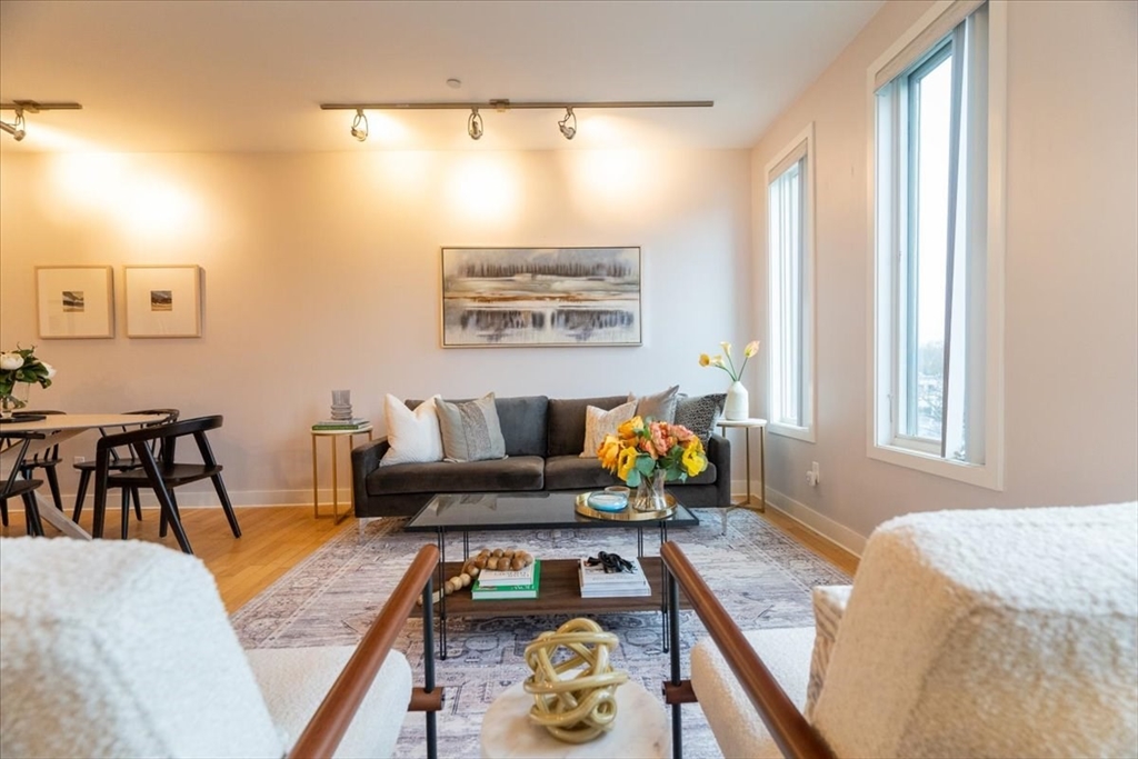 24 Bay State Road, Unit 18 Cambridge, MA 02138 - Photo 6 of 27 a living room with furniture and next to a window