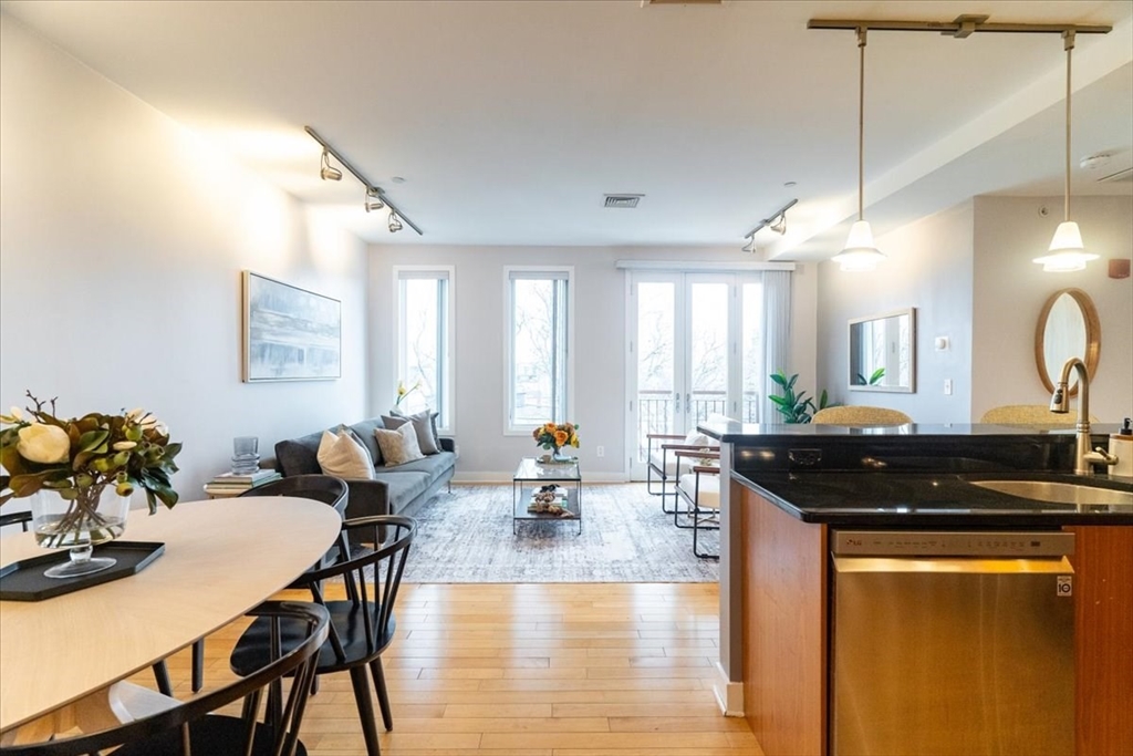 24 Bay State Road, Unit 18 Cambridge, MA 02138 - Photo 8 of 27 a view of a a dining room with furniture window and wooden floor