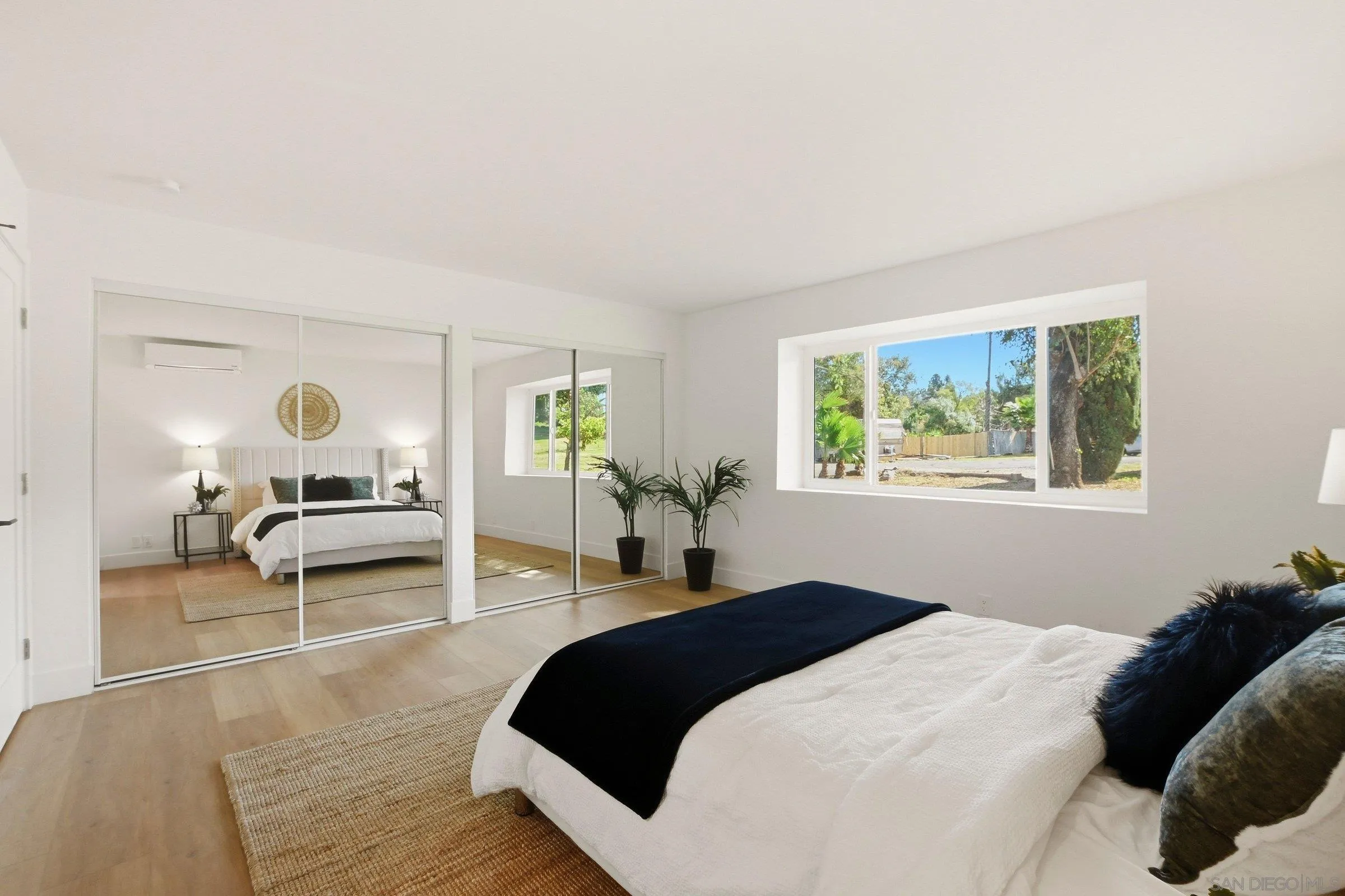 646 Barsby Street Vista, CA 92084 - Photo 33 of 48 a bedroom with a large bed and a window