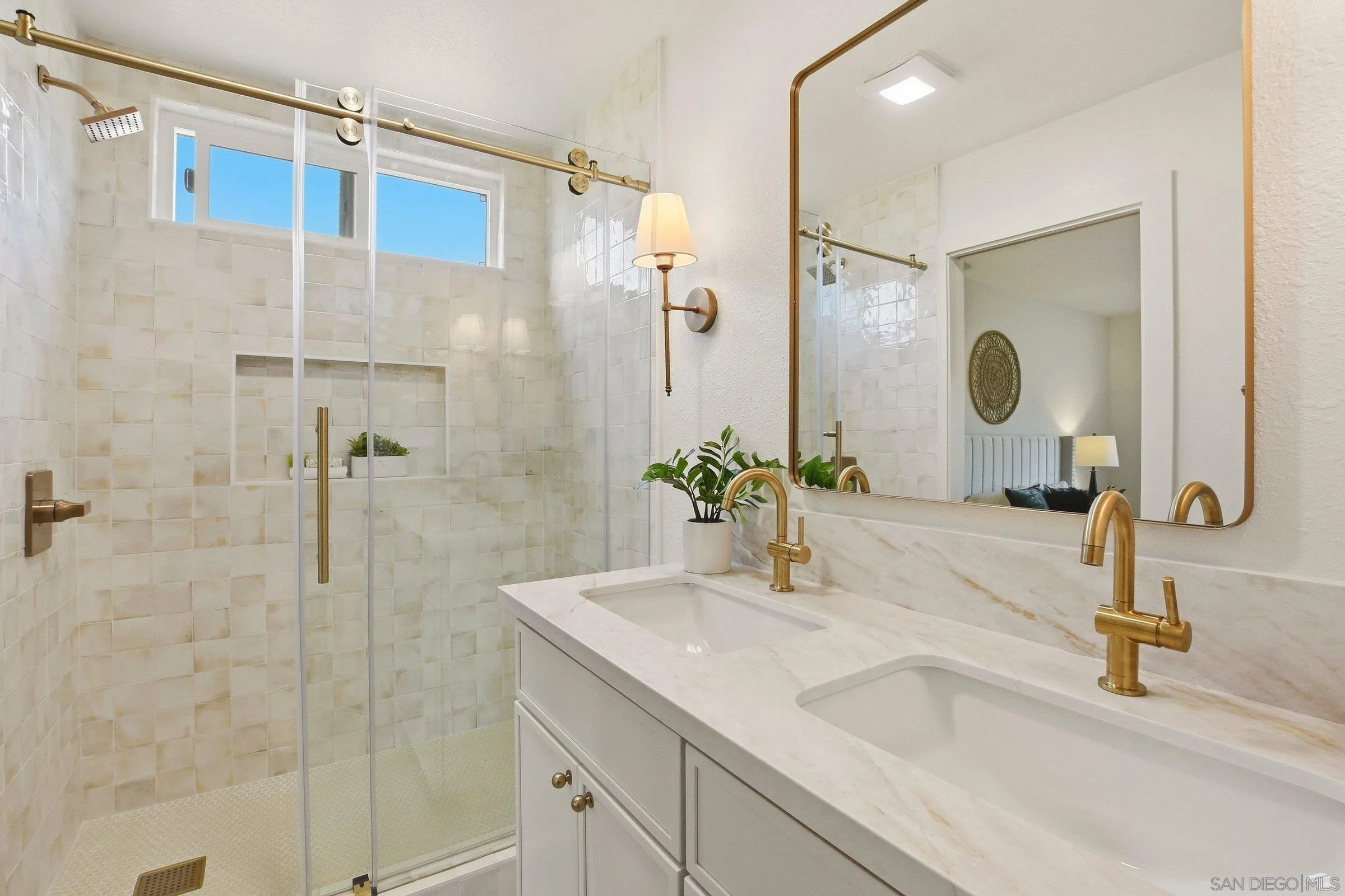 646 Barsby Street Vista, CA 92084 - Photo 5 of 48 a bathroom with a granite countertop shower sink and mirror