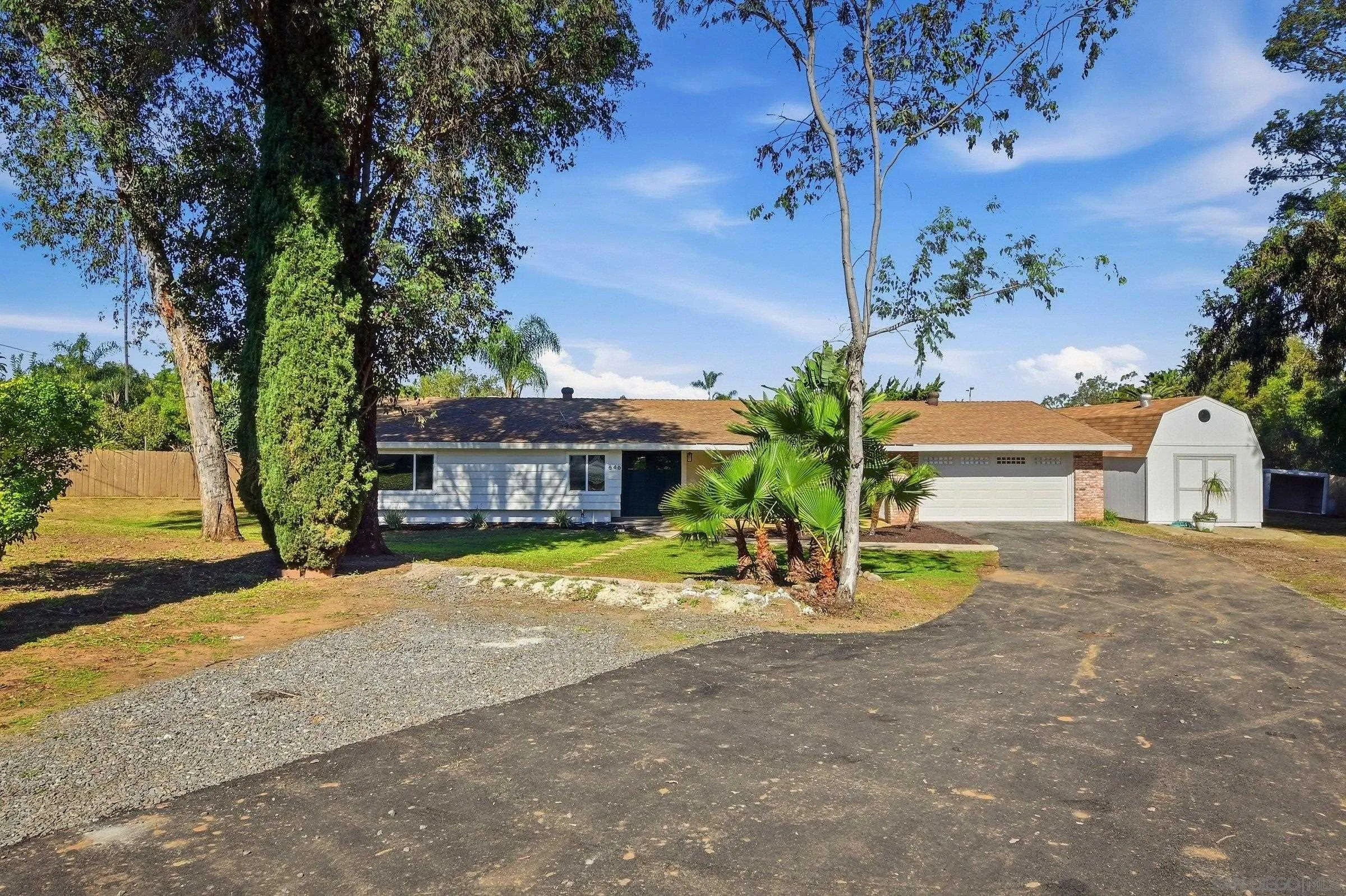 646 Barsby Street Vista, CA 92084 - Photo 6 of 48 a front view of a house with a yard and tree s