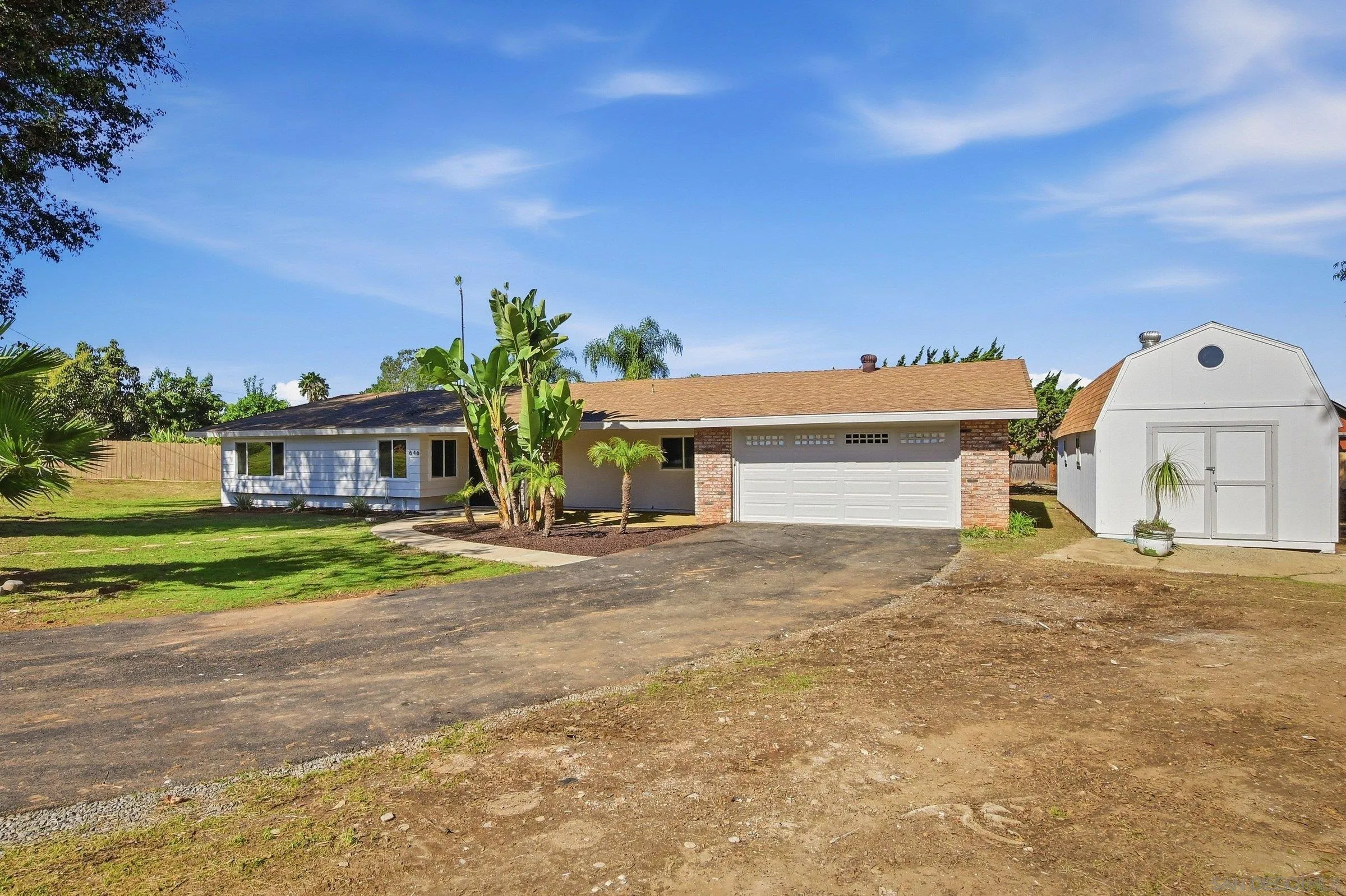 646 Barsby Street Vista, CA 92084 - Photo 7 of 48 a front view of a house with garden