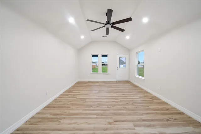 a view of an empty room and a window