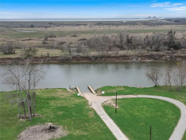 a view of a lake with a yard