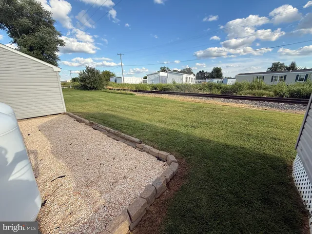 a view of a big yard with potted plants