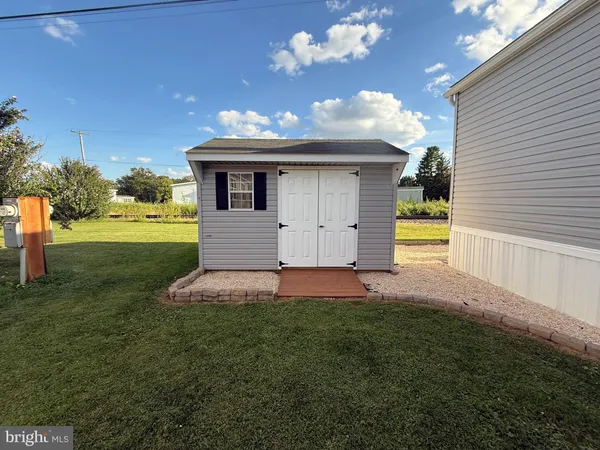 a view of a backyard of the house