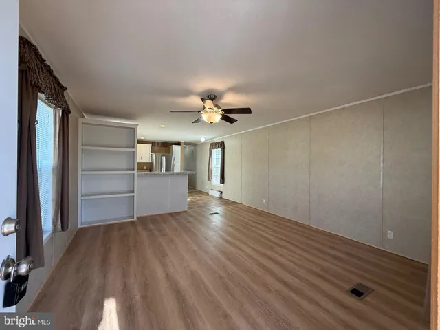 a view of a livingroom with wooden floor