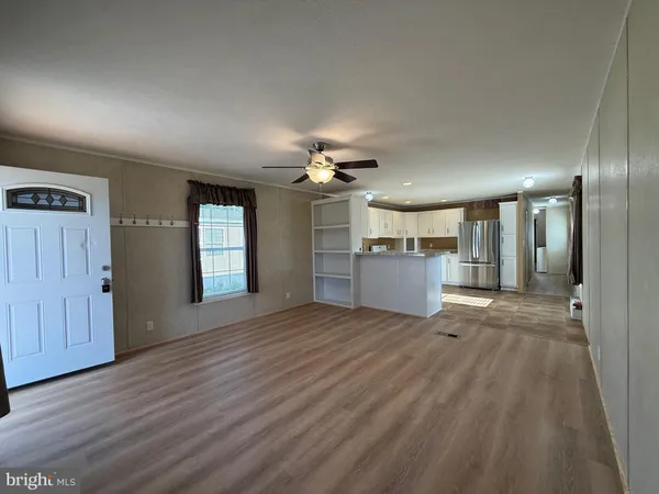 a view of a kitchen with a sink and a kitchen view
