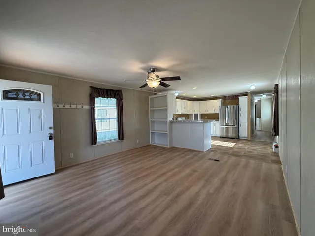 a view of a kitchen with a sink and a kitchen view