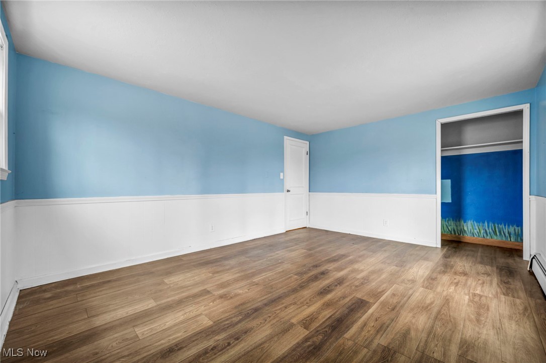 12150 Heath Road Chesterland, OH 44026 - Photo 21 of 43 Empty room with wood finished floors