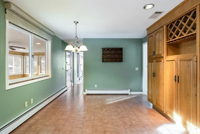 a view of a livingroom with an empty space and window