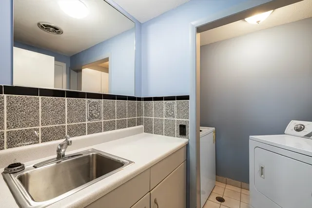 a view of storage and utility room with washer and dryer