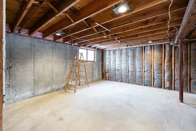 a view of an empty room with wooden walls