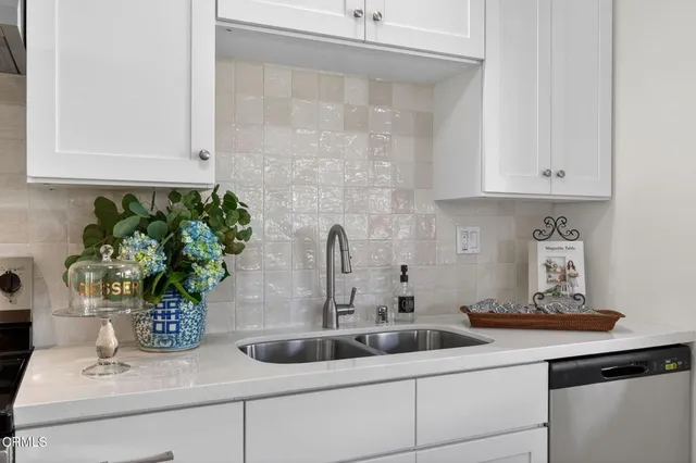 a kitchen with sink and window