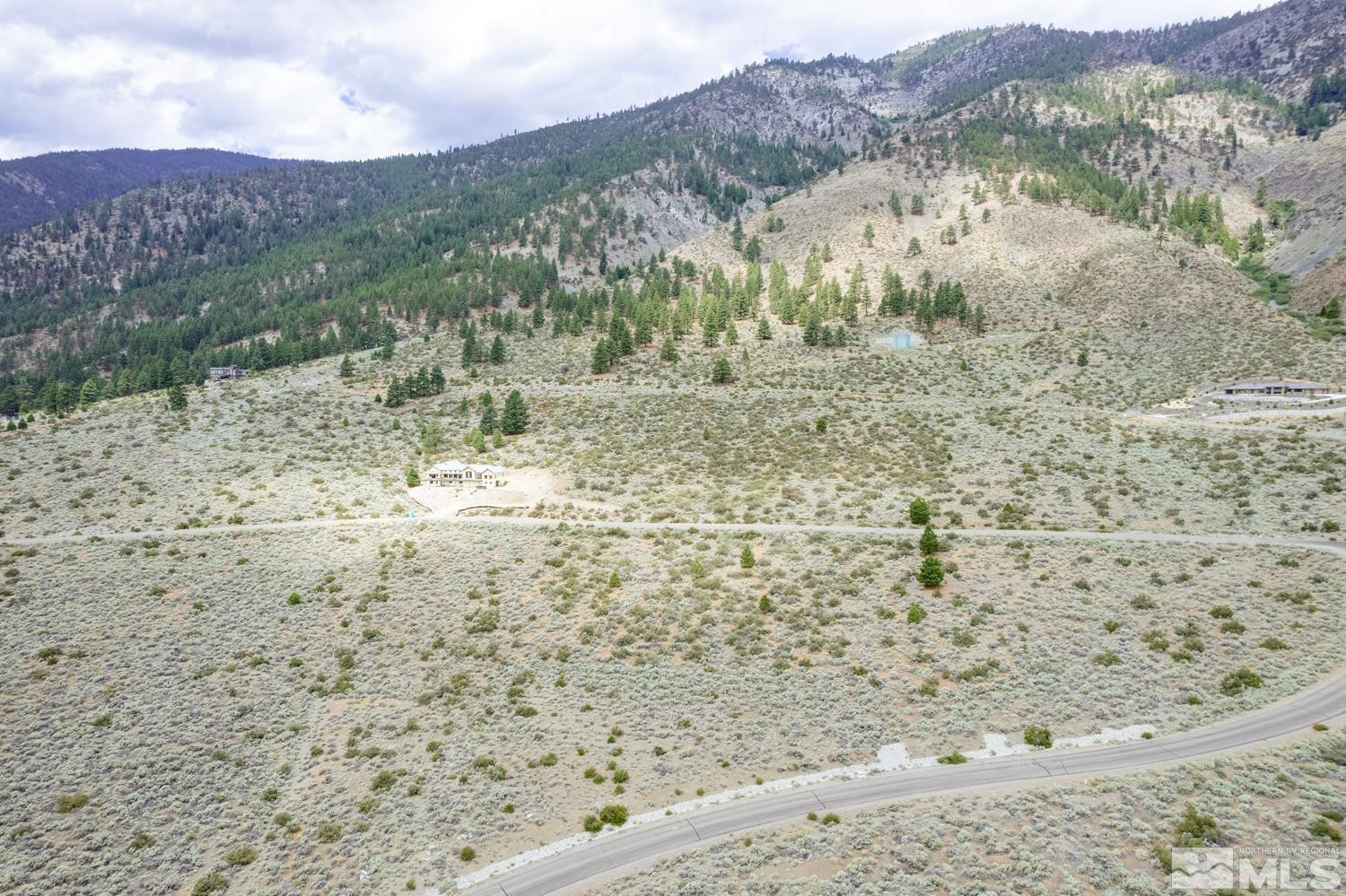 2533 Eagle Ridge Road, Unit 40 Genoa, NV 89411 - Photo 31 of 39 a view of a dry yard with mountains and green space