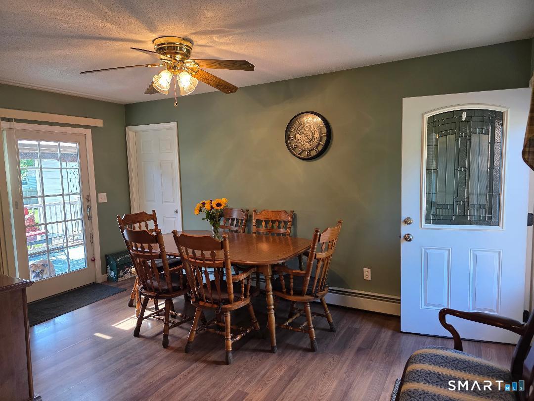 15 Van Buren Road Enfield, CT 06082 - Photo 23 of 40 a view of a dining room with furniture and wooden floor