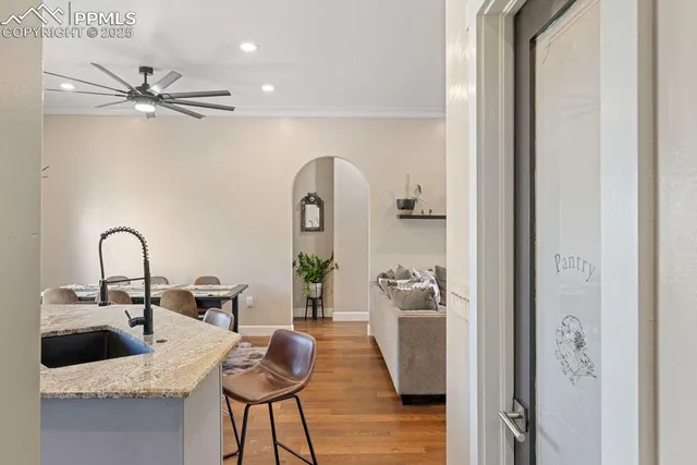 a kitchen with granite countertop a stove oven and sink