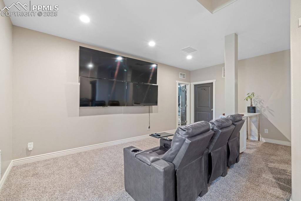 8450 Edison Road Yoder, CO 80864 - Photo 29 of 50 Home theater room featuring carpet flooring and recessed lighting