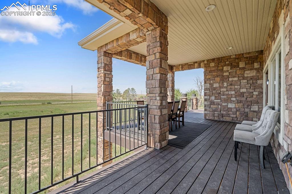 8450 Edison Road Yoder, CO 80864 - Photo 41 of 50 Deck featuring outdoor dining area and a yard