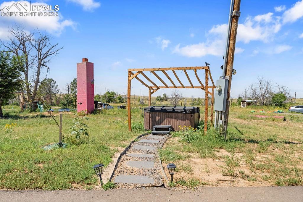 8450 Edison Road Yoder, CO 80864 - Photo 49 of 50 View of yard with a hot tub