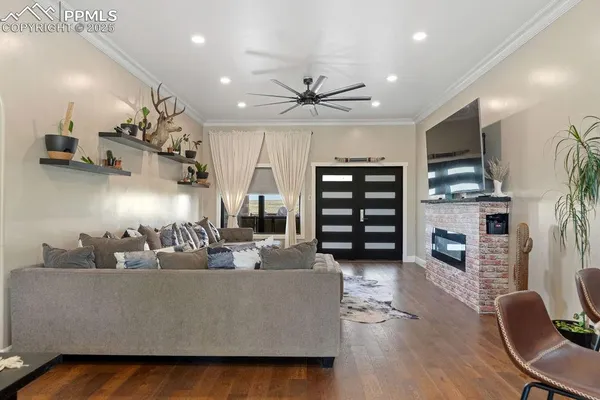 a living room with furniture and a flat screen tv