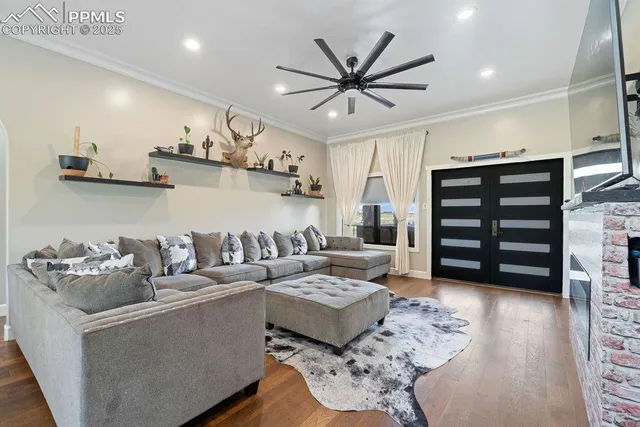 a living room with furniture and a flat screen tv