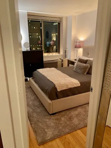 a white refrigerator freezer and a stove sitting inside of a kitchen