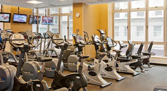 a bathroom with a sink a toilet a mirror and shower curtain