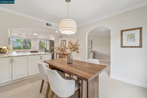 a kitchen with a table and chairs in it